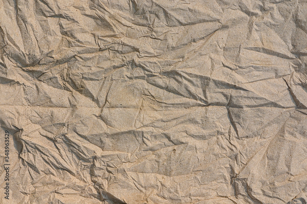 Poster brown crumpled paper texture background sheet of paper ,paper textures are perfect for your creative
