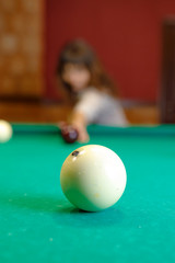 woman playing pool