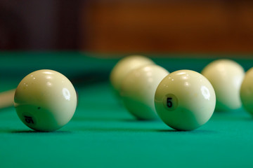 billiard balls on a green table