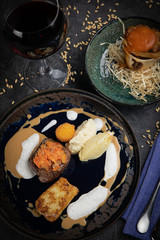 Meat grill set with wine on black wooden background