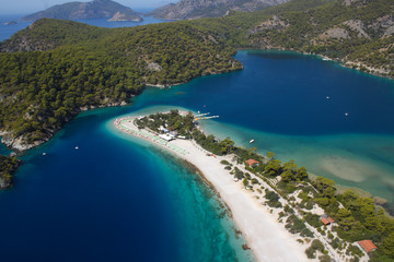 Obraz premium Top view, Blue Lagoon, Oludeniz coast, Fethiye, Mugla. Popular tourist place to travel in Turkey, nature reserve, banner