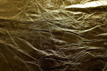 Crumpled golden texture, crumpled golden abstract background