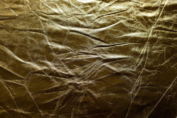 Crumpled golden texture, crumpled golden abstract background