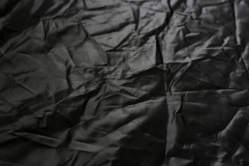 Crumpled black texture, crumpled black fabric, abstract background