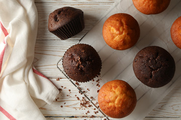 Composition with tasty muffins on white wooden background