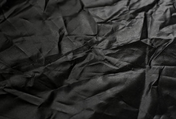 Crumpled black texture, crumpled black fabric, abstract background