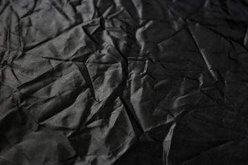 Crumpled black texture, crumpled black fabric, abstract background