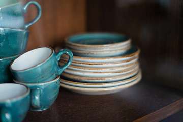 ceramic tea cup in the 
cupboard