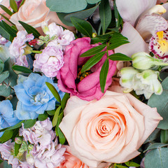 Fototapeta premium Bouquet of flowers from roses and lisianthus.