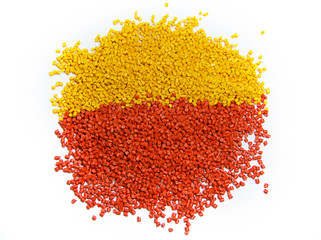 Colorful plastic polymer granules isolated on white
