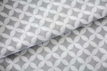 White and grey overlapped circles pattern fabric sample. Fabric background
