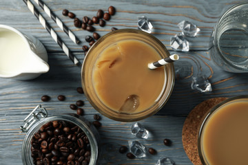 Composition with glasses of ice coffee on wooden background