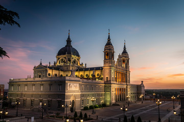 View of the Almudena cathedral at dusk in the city of Madrid, Spain.