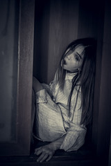 Portrait of asian woman make up ghost face with blood,Horror scene,Scary background,Halloween...