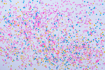 Abstract background multicolored small confetti on a white background. Copy space..