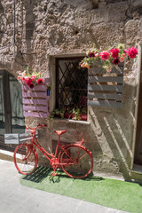 Fototapeta na wymiar Red bicycle with flowers