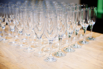 A lot of empty glasses on the reception party table. Glasses prepare to service for wedding or event