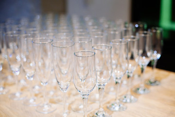 A lot of empty glasses on the reception party table. Glasses prepare to service for wedding or event