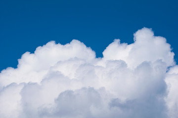 Naklejka na ściany i meble Clouds of cumulus clouds on a blue sky