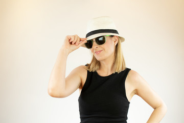 Pretty woman with hat and sunglasses