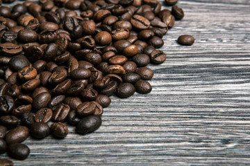 roasted coffee beans on wooden gray background