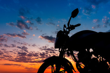 Motorcycle on a beautiful sunset evening sky