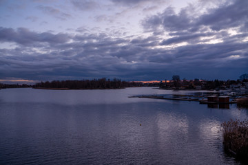 Lake by city against sky