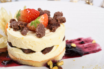 Limoncello mousse with cocoa almond cookies crumble.Traditional Italian pastry dessert vanilla cream