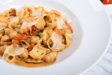 Pasta gnocchi sardi with fresh cherry tomatoes sauce, basil and Parmesan cheese.Menu view from above
