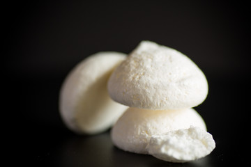 Fototapeta na wymiar sweet tasty white meringues with a burlap tablecloth