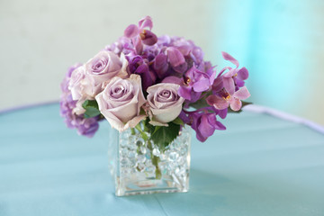 Close up of a flower at the entrance of a party.