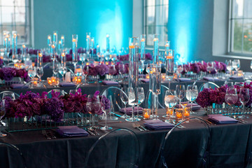 Wide empty shot of table setting at a formal party at dusk.