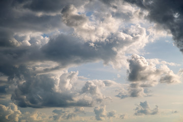 Cirrus gray-white clouds on a blue sky close-up