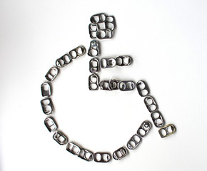 Recyclable Aluminum Lid Placed as a disabled symbol on a white background Can be used to make prostheses or aluminum prostheses