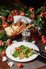 Caesar salad with chicken, cherry tomatoes, lettuce
