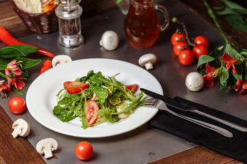 Caesar salad with chicken, cherry tomatoes, lettuce