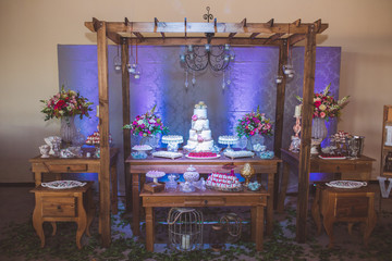 cake table decorated with cake and sweets