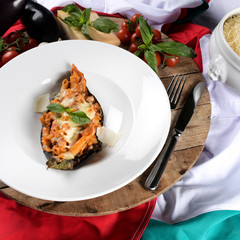 Penne with tomato sauce, eggplant, mozzarella. Vegetarian dish, traditional italian cuisine.