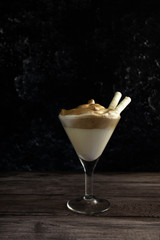 Dalgona coffee - the Korean coffee drink on wooden background, Iced, whipped, dalgona coffee concept, dalgona coffee with waffle tubes