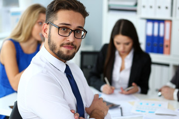 Handsome smiling bearded clerk man wearing glasses