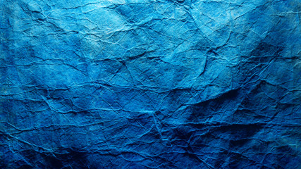 Abstract phantom blue wallpaper background. Crumpled paper texture, deep ocean color