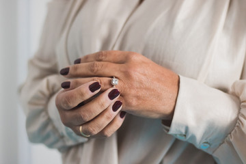 woman putting on a ring