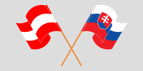 Crossed and waving flags of Slovakia and Austria