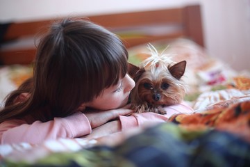 girl with a dog at home playing