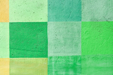 Fototapeta premium Concrete painted wall; square abstract background, with green color prevailing