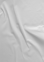 Obraz premium Glued paper for poster texture. Blank white crumpled and wrinkled paper template for background. Matted wet paper wrinkled for mockup posters