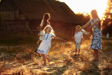 happy young moms playing with their kids outdoors in summer. Happy family time together concept. selective focus.