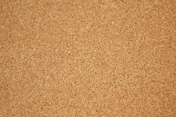 Brown / yellow color of cork board. Textured wooden background. Cork board with copy space. Notice...