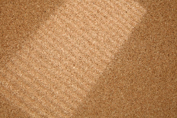 Shadow Line From the Window on Cork Board. Cork  background with blinds light and shadows