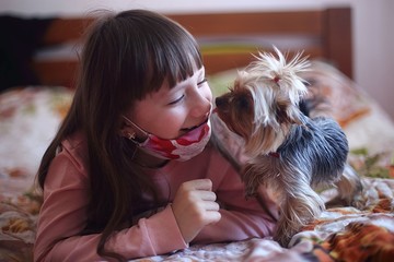 girl with a dog at home playing